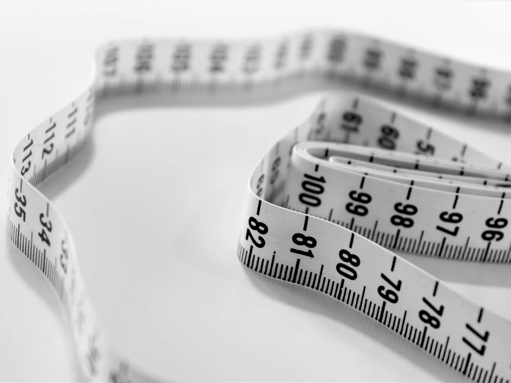 selective focus photography of tape measure